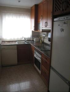Kuchyň nebo kuchyňský kout v ubytování Apartamento frente al mar