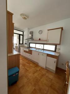 a kitchen with a sink and a counter top at Piso Tamaragua in Arrecife +16 photos
