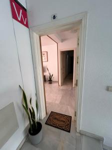 a hallway with a door leading into a room at Piso Tamaragua in Arrecife