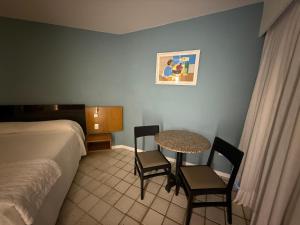 Cama ou camas em um quarto em HOTEL PIRÂMIDE NATAL