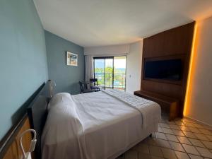 Cama ou camas em um quarto em HOTEL PIRÂMIDE NATAL