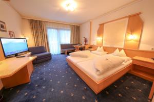 Ein Bett oder Betten in einem Zimmer der Unterkunft Superior Hotel Persal