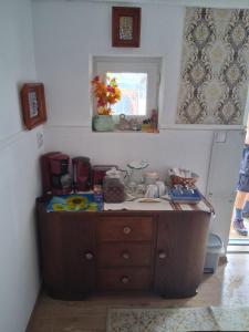 a kitchen with a wooden counter top in a room at Casa Denis rustic in Turda