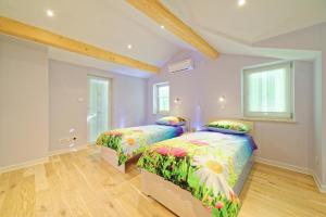 Postel nebo postele na pokoji v ubytování Villa Demetra + 13 fotografií