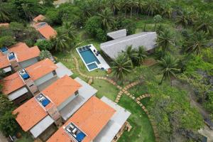 an overhead view of a house with orange roofs at Chalé Iracema – Atins-MA in Atins