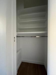 a closet with white walls and a white ceiling at Pauline in Neuilly-sur-Seine