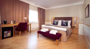 Ένα ή περισσότερα κρεβάτια σε δωμάτιο στο Home Hotel Kompaniet