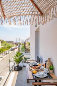 a dining room with a table with food on it at Diamante Del Mar Thalia and Erato in Kos