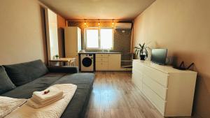 Posezení v ubytování NEO - Trei - Cosy Studio + 9 fotografií