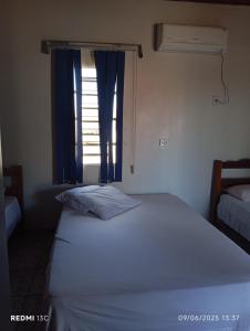 Hotel Ouro Fino客房内的一张或多张床位