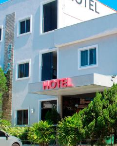 a hotel with a hotel sign in front of it at Hotel Aeroporto Montese Star in Fortaleza
