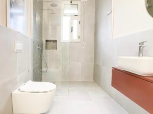 a bathroom with a toilet and a sink at Smart Budget EDITION - Cozy Apartment in Golem +49 photos