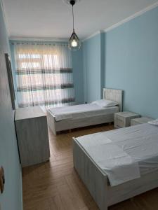 Una cama o camas en una habitación de Likaj rent home