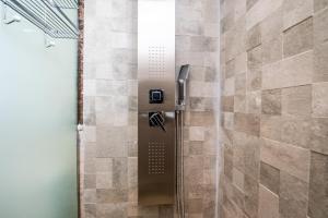 a shower with a glass door in a bathroom at New Luxury Apartment 130sqm with SeaView WiFi Unlimited with Optical Fiber in Agadir +66 photos