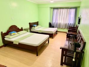 Postel nebo postele na pokoji v ubytování Albergo Hotel - Studio Condo Unit - Baguio Transient