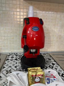 a red mixer sitting on top of a counter at AltaMil Home in Altavilla Milicia +24 photos