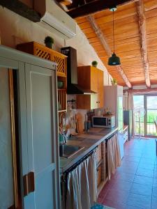 a kitchen with a sink and a counter at Cercado de arriba in Cortelazor +29 photos