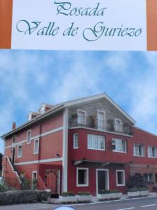 a picture of a red building with the words lasagnaalealequez at Posada Valle De Guriezo in Ríoseco
