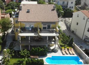an aerial view of a house with a swimming pool at Apartment MILA in Senj