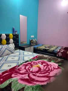 Ένα ή περισσότερα κρεβάτια σε δωμάτιο στο Tiwari home stay