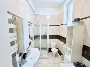 a bathroom with a toilet and a sink at Studio 5 étoiles à deux pas de Monaco ! in Beausoleil +30 photos