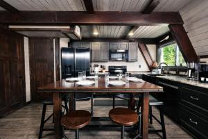 a kitchen with a large wooden table and chairs at Amazing Grace Where Peace Finds You in Pigeon Forge