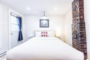 Ένα ή περισσότερα κρεβάτια σε δωμάτιο στο Signal Hill Rowhome 3br Harbour View Patio