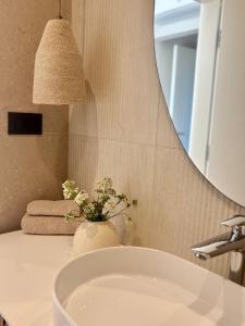 a bathroom with a sink and a mirror at Villa Olea Mare Mediterranean Comfort & Style in Malinska +28 photos