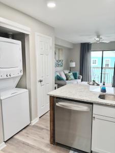 a kitchen with a sink and a counter top at Renovated OC Condo Walk to Beach Pool & Park in Ocean City