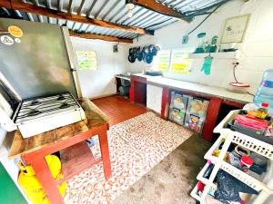 a kitchen with a counter and a stove in it at 4 Amigos El Zonte in El Zonte