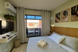a bedroom with a bed with a towel on it at Condomínio Summer Park Bloco G in Brasilia