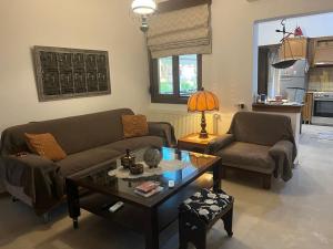 a living room with a couch and a coffee table at Second Home Ierissos in Ierissos