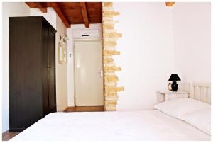 Postel nebo postele na pokoji v ubytování Guest House Tragurion