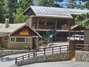 a building with a fence in front of it at Holiday Haus in Mammoth Lakes