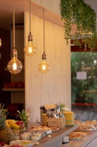 a buffet of food on a table with lights at Corazon de la Sierra in Tandil