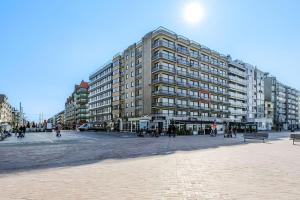 a large building in the middle of a city at Grand Hotel D3 G in Oostduinkerke
