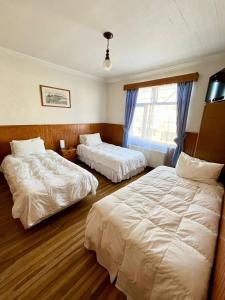 Postel nebo postele na pokoji v ubytování CHALET CHAPITAL Punta Arenas