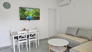 a living room with a couch and a table at ValMar in Šušanj