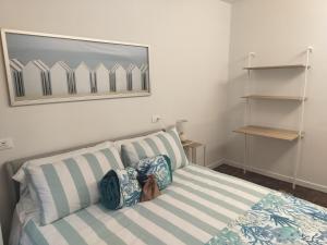 a bedroom with a bed with two pillows on it at Lerici Charme in Lerici +6 photos