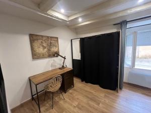 Ένα ή περισσότερα κρεβάτια σε δωμάτιο στο Appartement Limoges