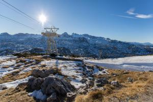a ski lift on top of a snow covered mountain at Pension Bergfried in Hallstatt