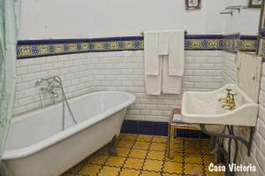 a bathroom with a tub and a sink at Casa Victoria in La Vilella Baixa +28 photos