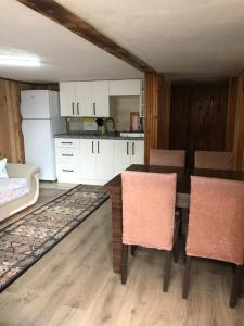 a kitchen and dining room with a table and chairs at Guesthouse Dolunay in Ayder Yaylasi