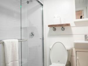 a bathroom with a shower and a toilet at Stones Throw in York Beach
