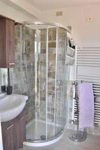 a bathroom with a shower and a sink at Cottage with large terrace in Corropoli +5 photos