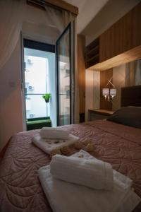 Postel nebo postele na pokoji v ubytování Zeus Apartman