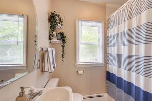 a bathroom with a sink and a mirror at Walk to Downtown Wakefield Haven Near Beaches in South Kingstown +16 photos
