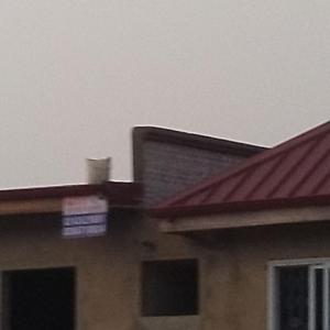 a close up of a house with a red roof at Boomville suites in Tokuse