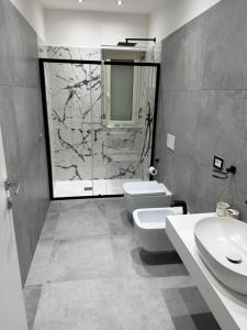 a bathroom with a toilet and a sink and a shower at Casa margherita in Bova Marina +51 photos
