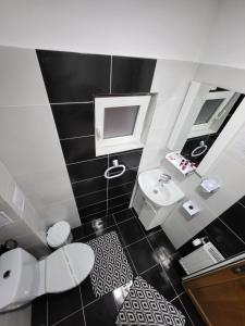 Koupelna v ubytování CASA ROXI + 9 fotografií